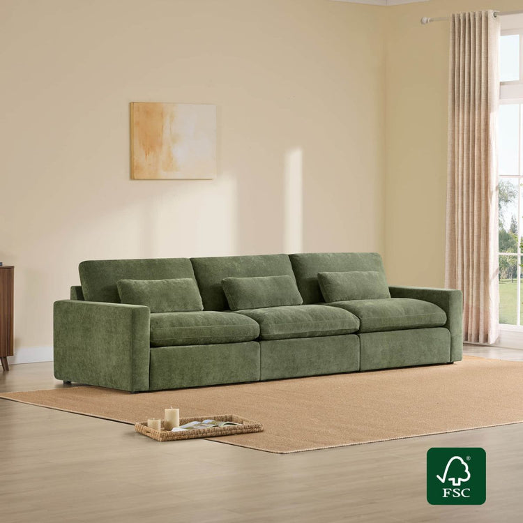 Green 3-seat modular sofa with plush cushions on a beige rug, featuring the FSC logo.