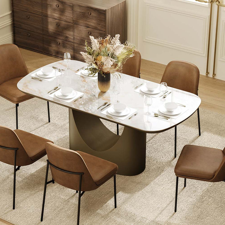 71” Layla Sintered Stone dining table with elegant soft corners and bronze sculptural base.