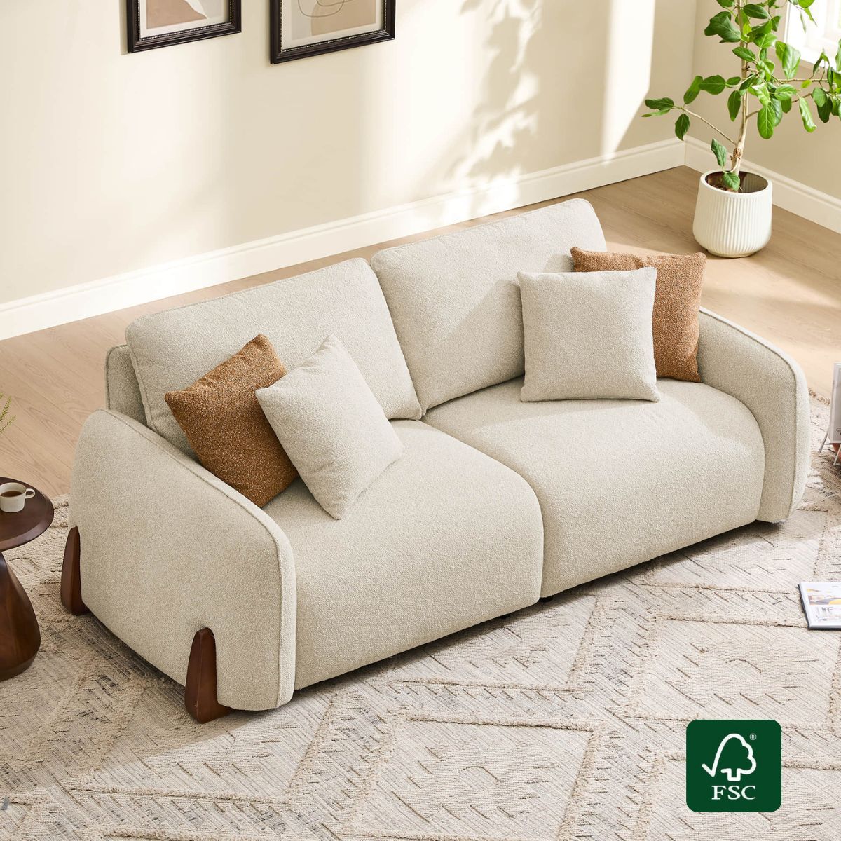 Teleri 2-seat curved modular sofa, light cream textured fabric, wood legs, lifestyle setting.