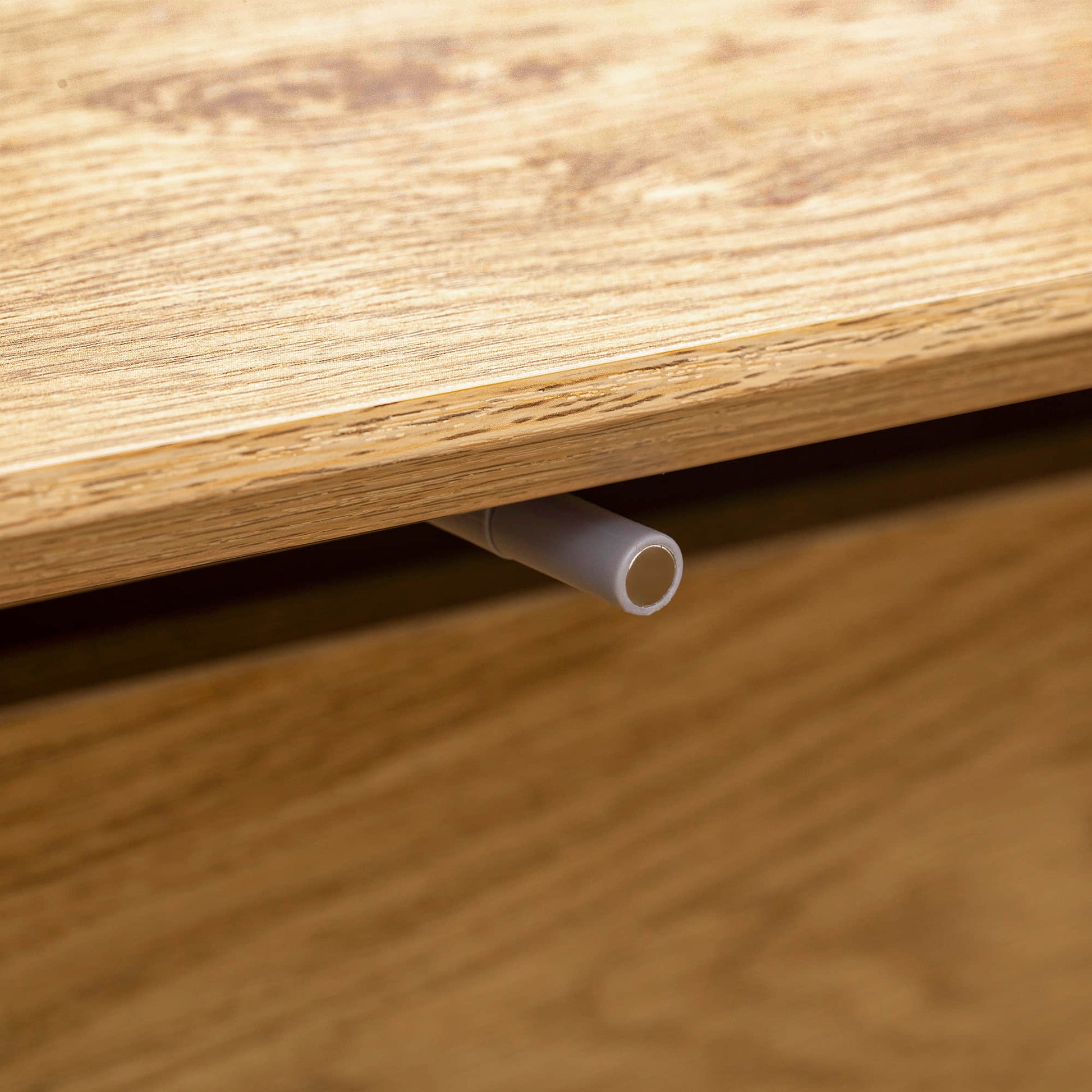 TV stand wood grain close-up and leg attachment detail view.