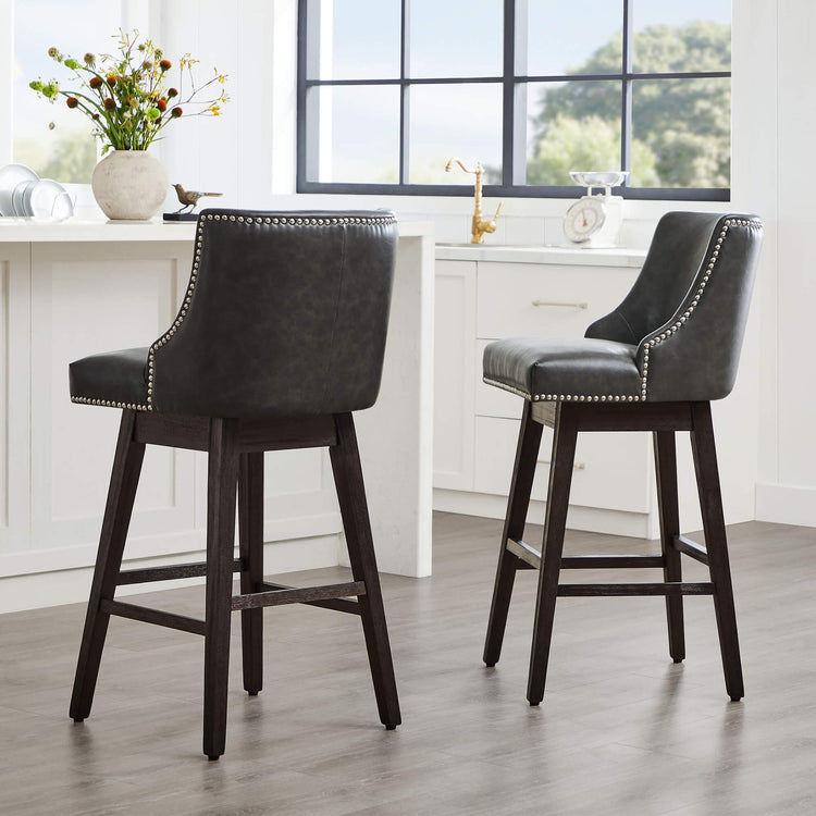 Dark gray Asher swivel bar stools with silver nailhead trim in modern kitchen - CHITA Living