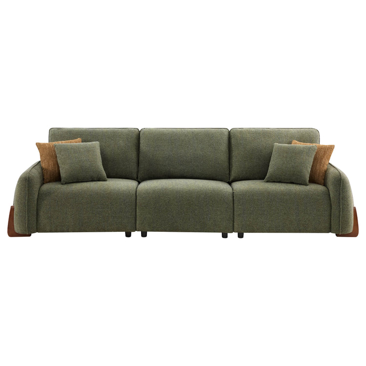 Teleri 3-seat modular curved sofa in green textured fabric with brown wood legs and accent pillows.