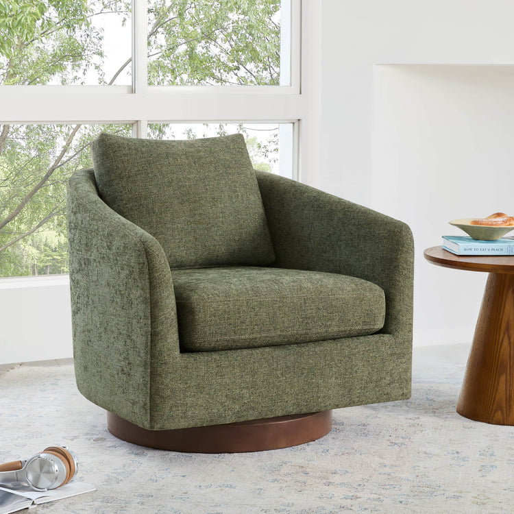 Green Wren modern swivel accent chair with round wood base and cushion.