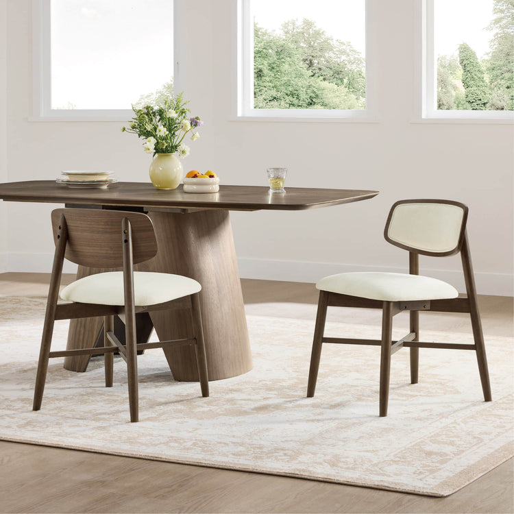 Wyatt minimalist wood dining chairs featuring upholstered cream seats and backs, set of 2.