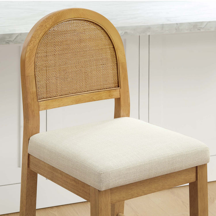 Abigail Rattan Curved Counter Stool features a woven backrest and cushioned seat, blending modern design with natural materials.