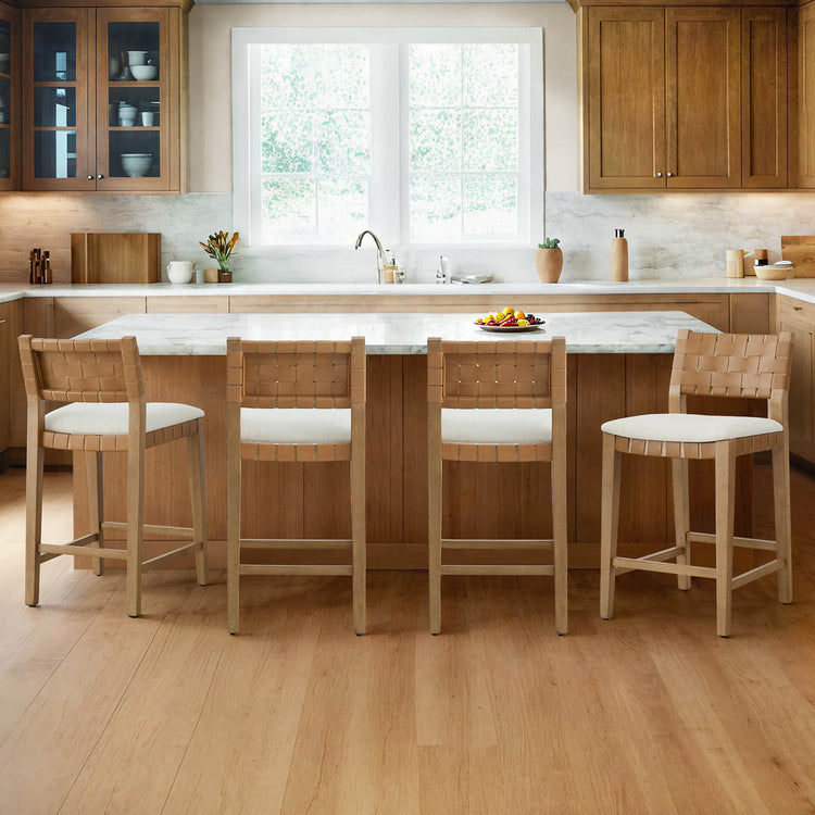 Aries Mid-century Modern Handwoven Counter Stools with white cushions and wooden frames in a stylish kitchen.