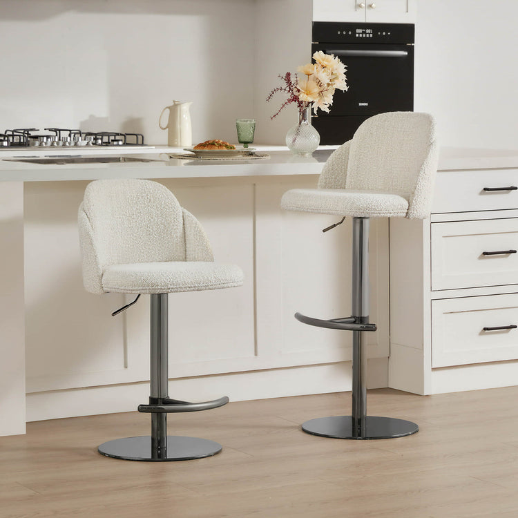 CHITA LIVING Blythe bar stools in a modern kitchen setting, featuring white boucle fabric and adjustable height swivel.