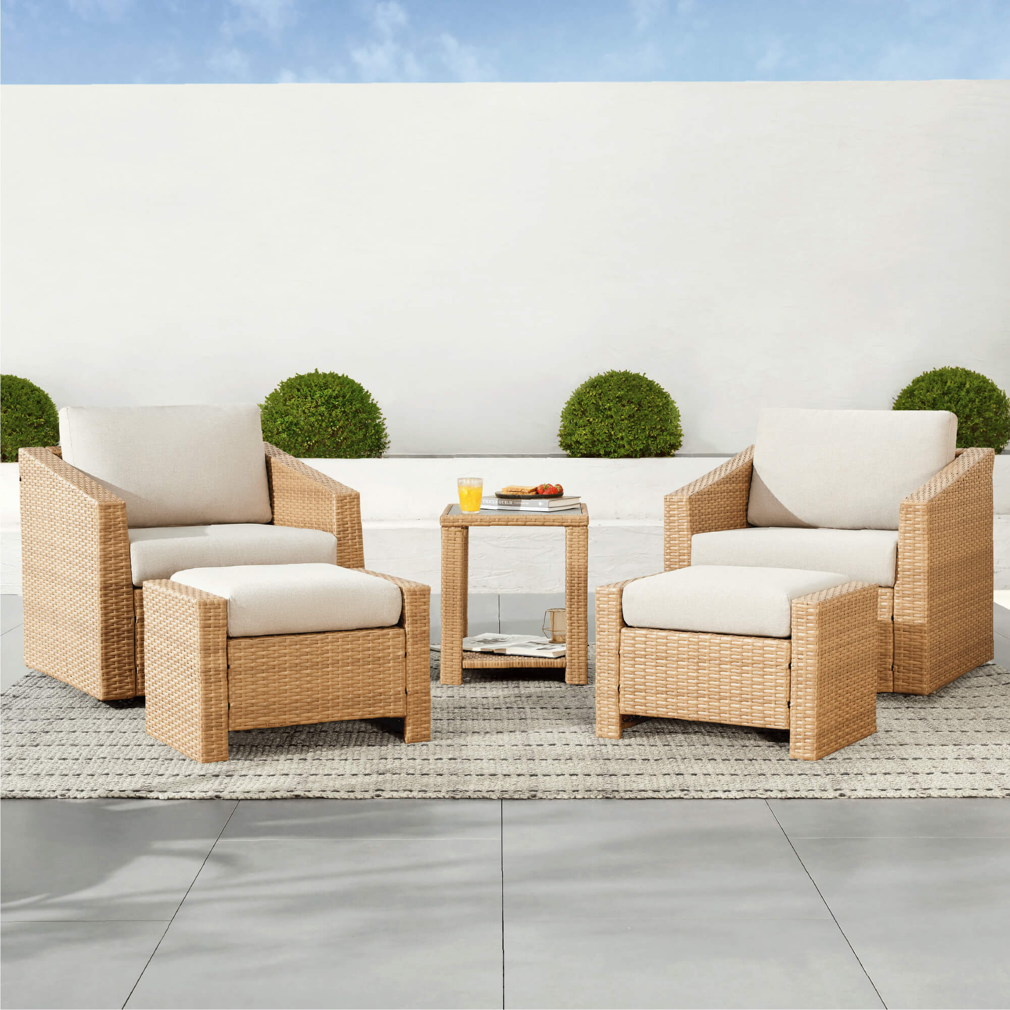 Stylish Calum Rattan outdoor seating set with cream cushions and side table - CHITA Living