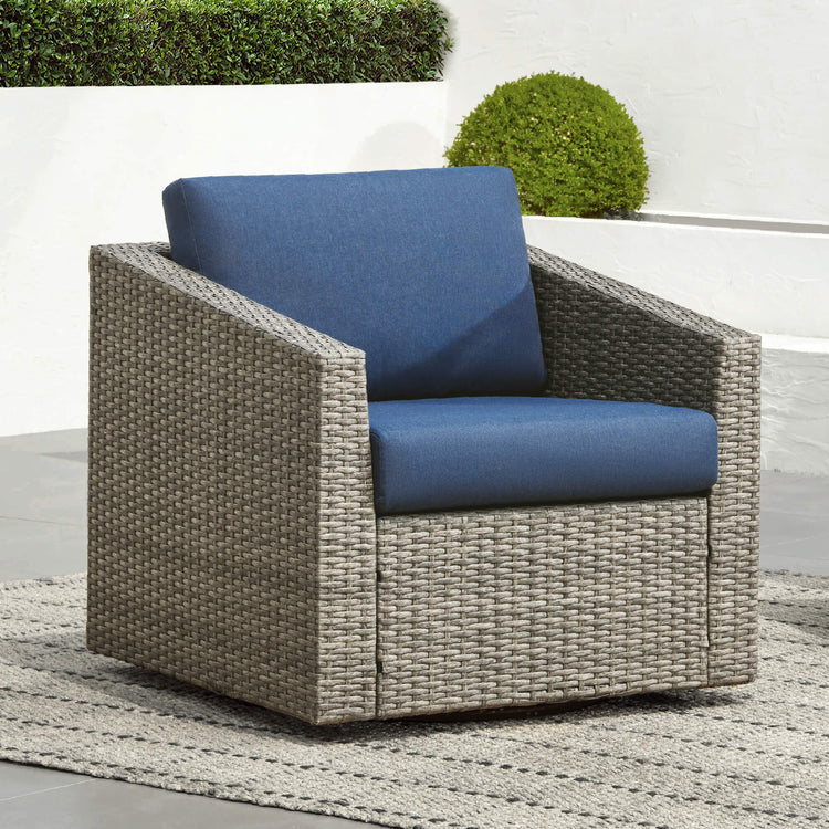 Calum Rattan Outdoor Swivel Accent Chair with blue cushion, perfect for patios - CHITA Living