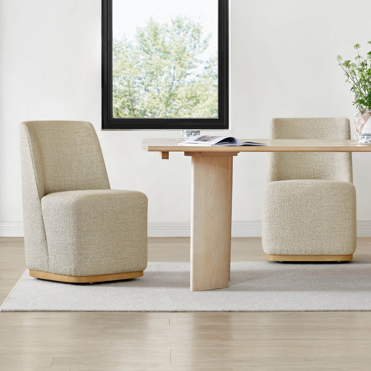 Textured boucle fabric dining chairs with a wooden dining table in a bright setting - CHITA Living