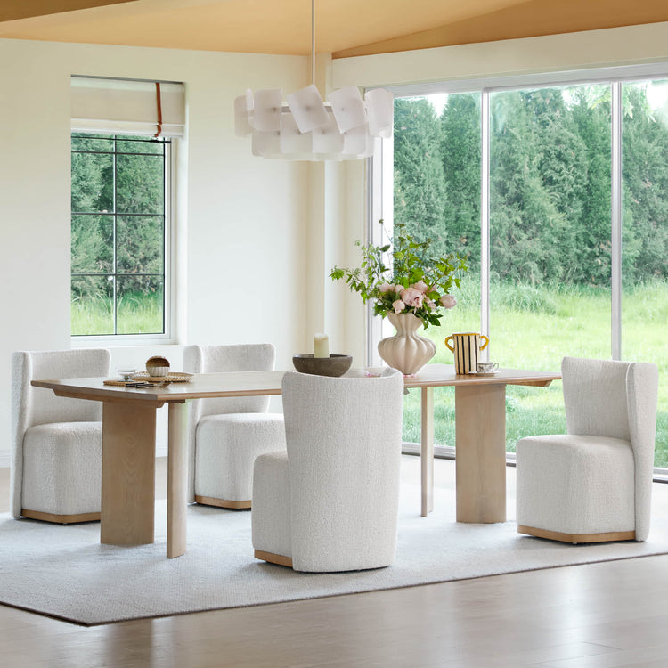 Modern dining room featuring stylish wingback chairs and a wooden dining table - CHITA Living