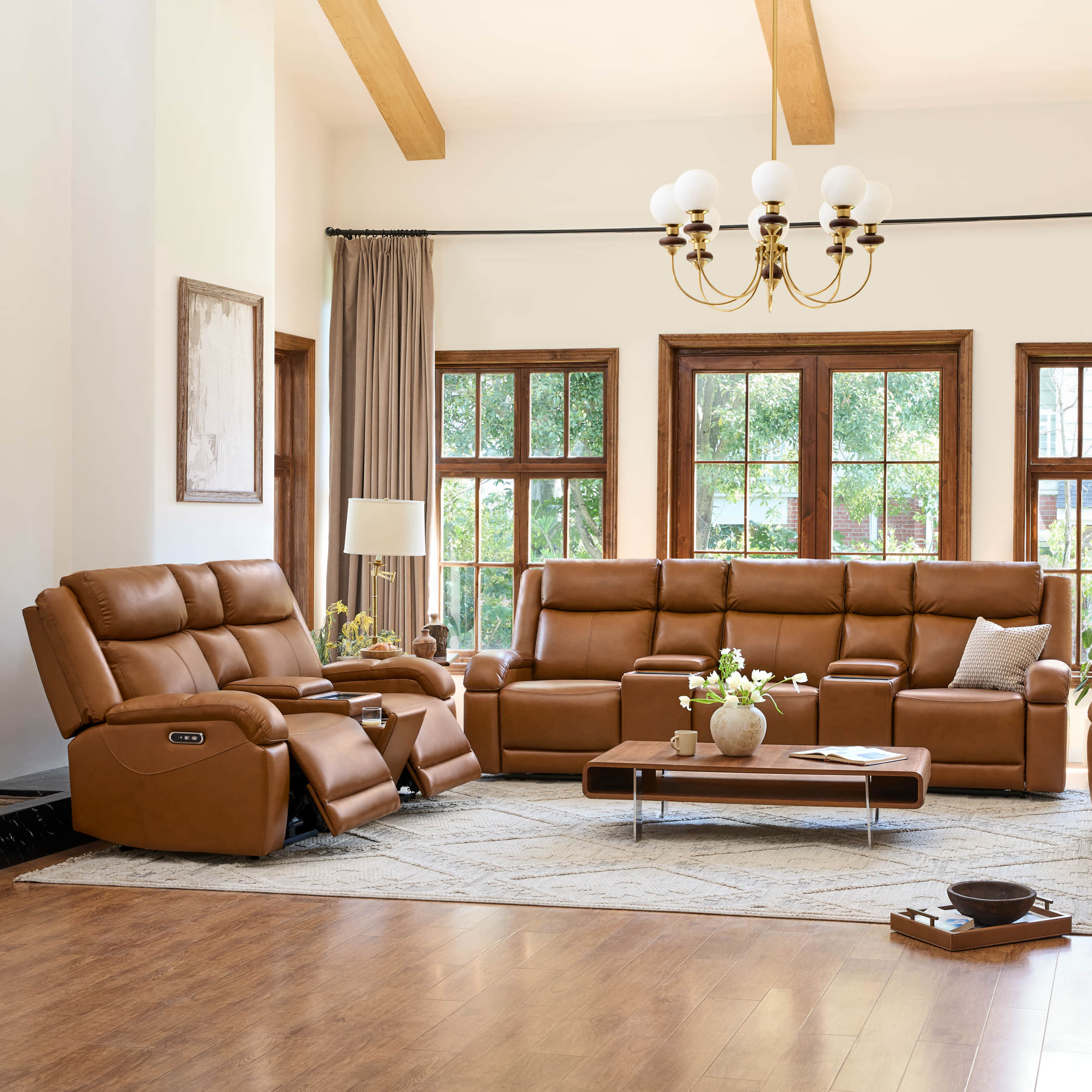 Isaac leather power reclining sofa in a living room setting, featuring a power headrest and convenient charging ports