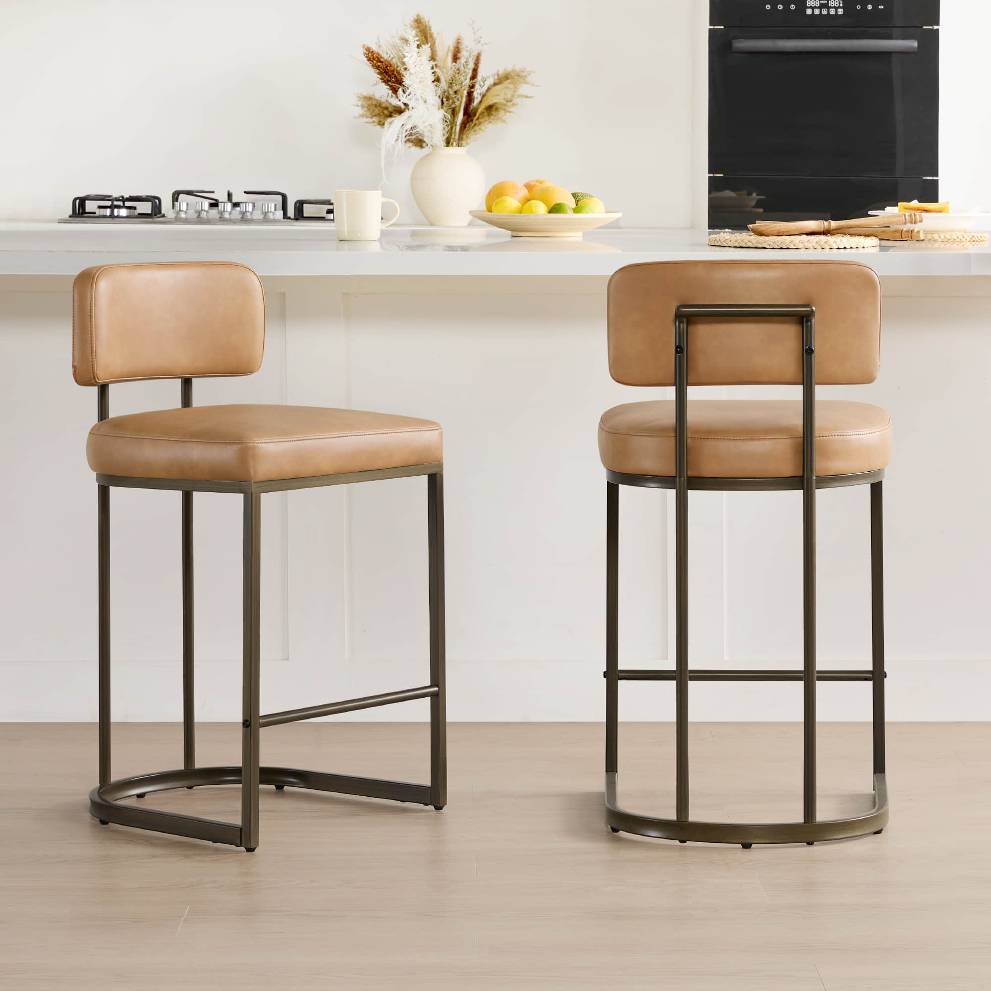 Stylish brown leather bar stool at a kitchen island, perfect for modern home decor.