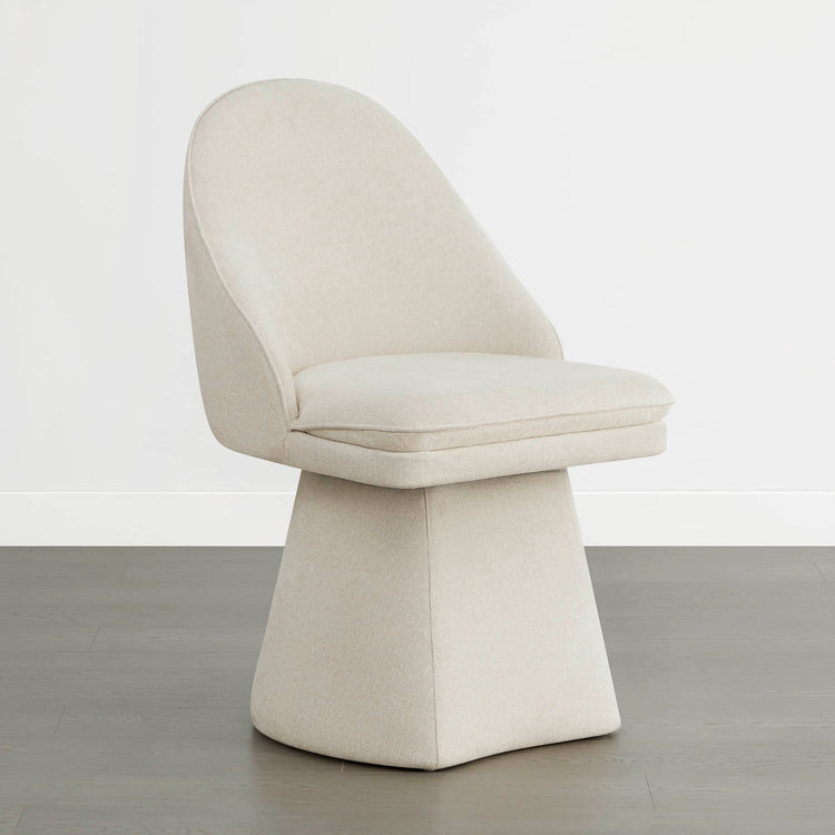 Cream swivel chair with modern design, rounded backrest, and cushioned seat.