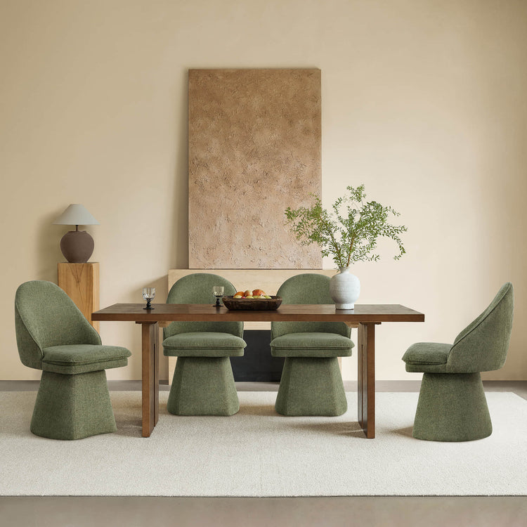 Dining room with a wooden table, four green swivel chairs, and beige decor.