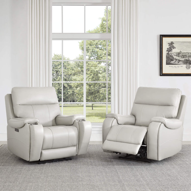 Two light gray Noah zero-gravity leather recliners facing each other in a bright room - CHITA Living