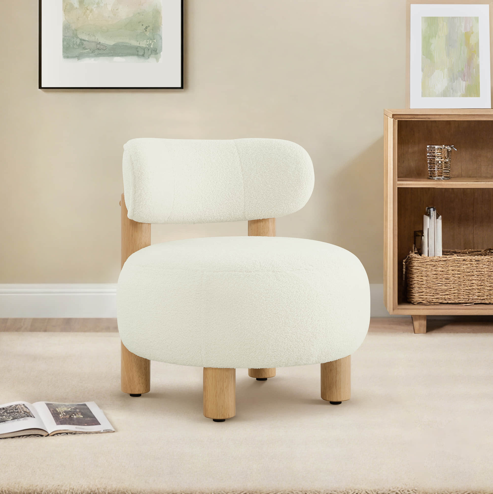 A cozy white plush faux sherpa accent chair with wooden legs rests on a carpeted floor, beside a bookshelf and an open magazine.