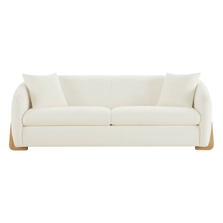Modern cream sofa with wooden accents, elegant design.