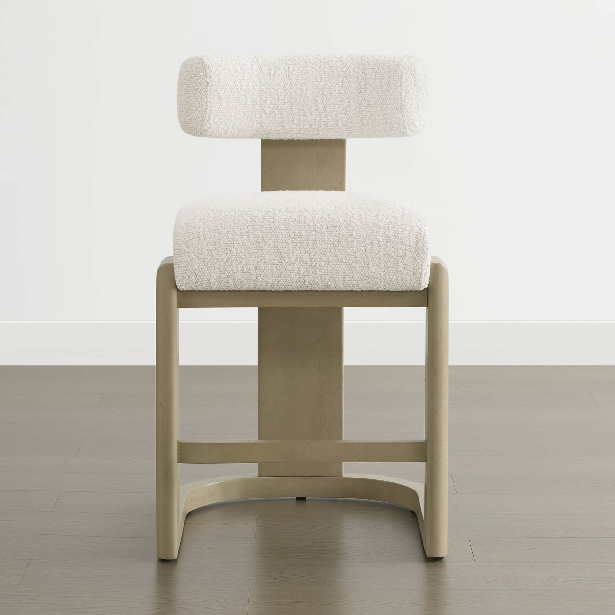 Troy Boucle Counter Stools with solid wood frames and white upholstered seats offer a sleek, modern design for stylish seating.