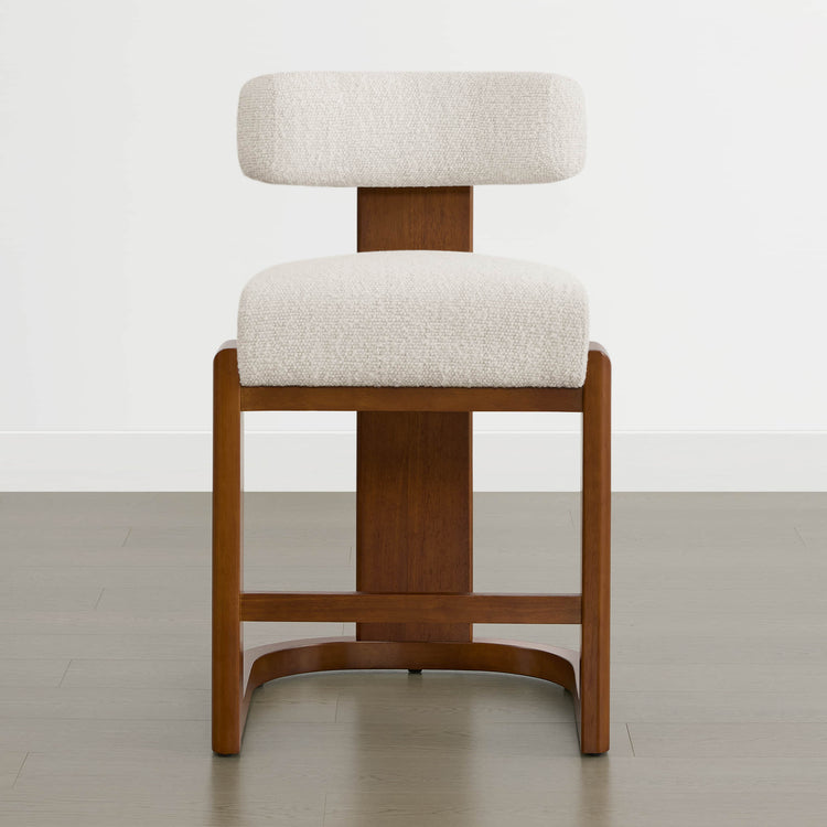 Troy Boucle Counter Stools feature solid wood frames with a cream bouclé upholstered seat and backrest, blending comfort and style.