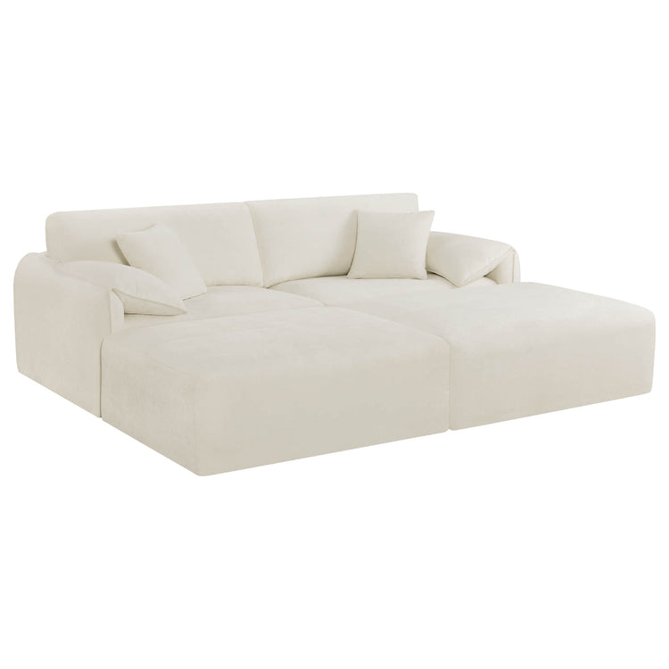 The Winsley 3-Seat Sofa with Ottoman is a plush, off-white sectional featuring comfortable cushions and a modern design.