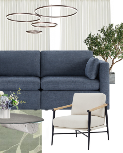 A modern living room with a dark blue sectional sofa, a beige armchair