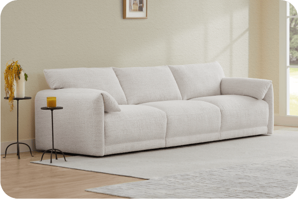 Cozy modern Josie sofa in light fabric, complemented by side tables and warm decor - CHITA Living