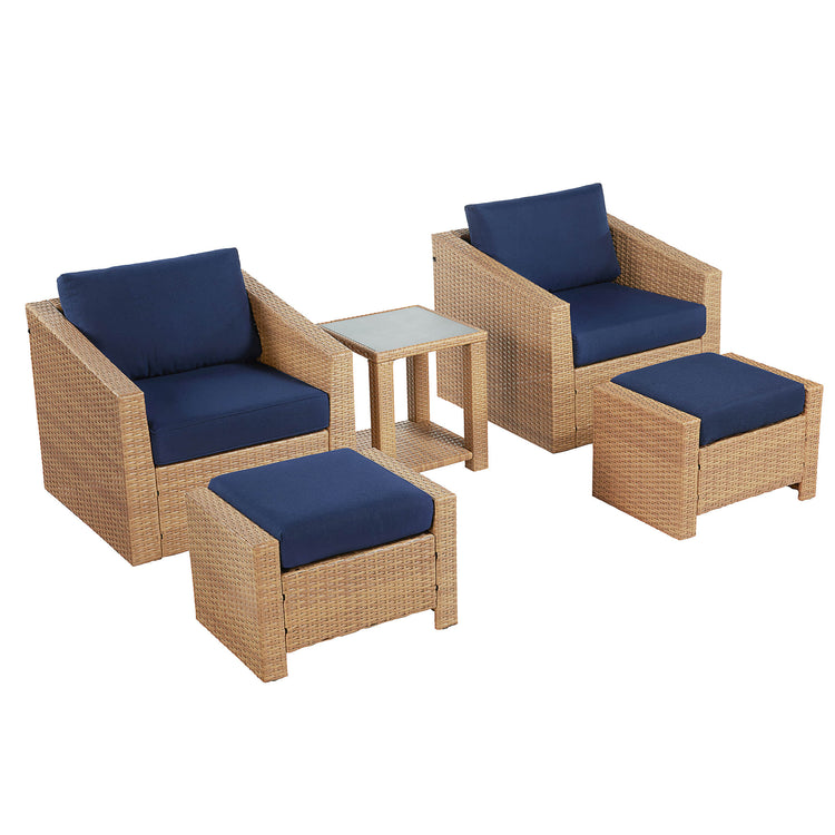 Calum Rattan outdoor patio set with navy cushions, side table, and footrests - CHITA Living