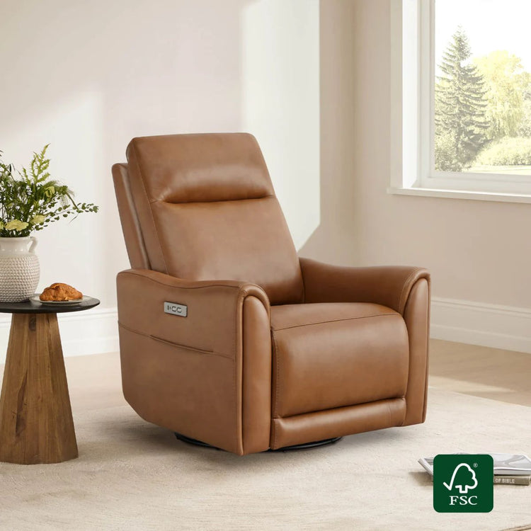 A tan leather power swivel glider recliner positioned next to a side table with a plant.