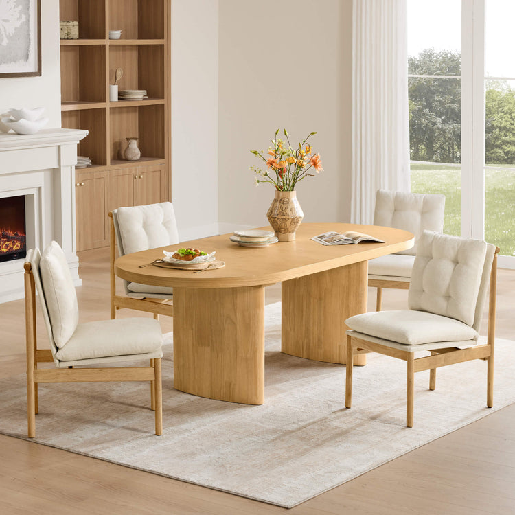 Flynn Mid-Century Tufted Plush Dining Chairs in Linen paired with a light wood oval dining table.