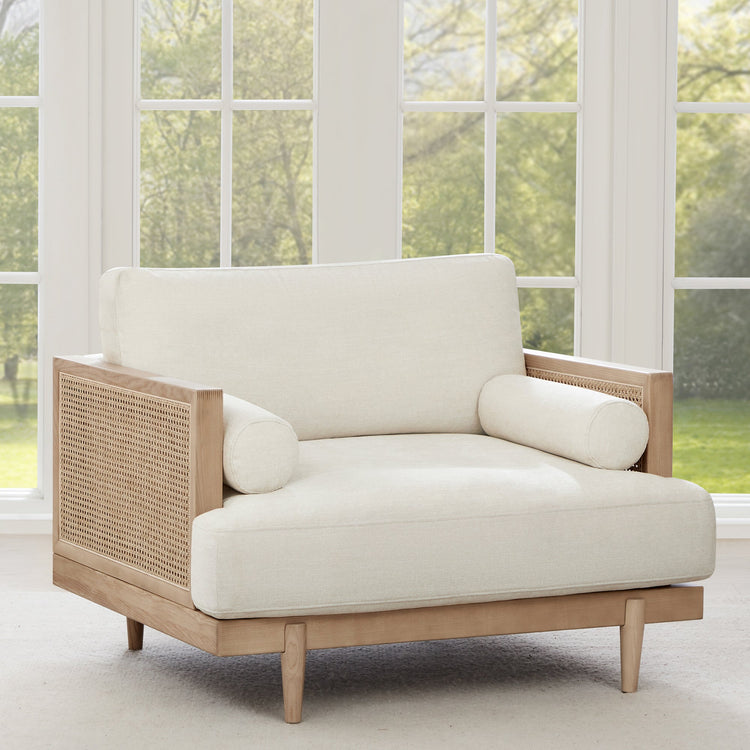 Julane modern cane armchair with light fabric and natural wood frame - CHITA Living