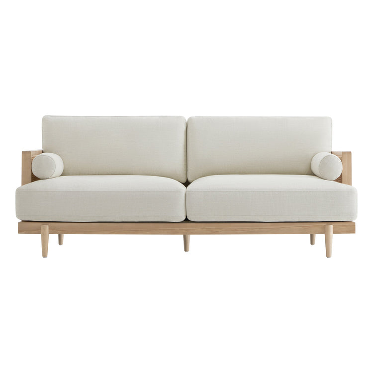 Julane Modern 3-Seater Cane Sofa with light fabric, wooden legs, and round side cushions - CHITA Living