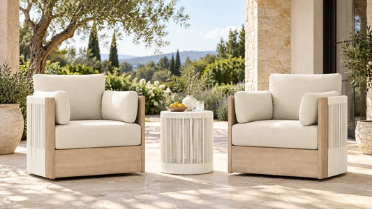 Clover acacia-frame woven outdoor chairs and a matching round table on a covered terrace.