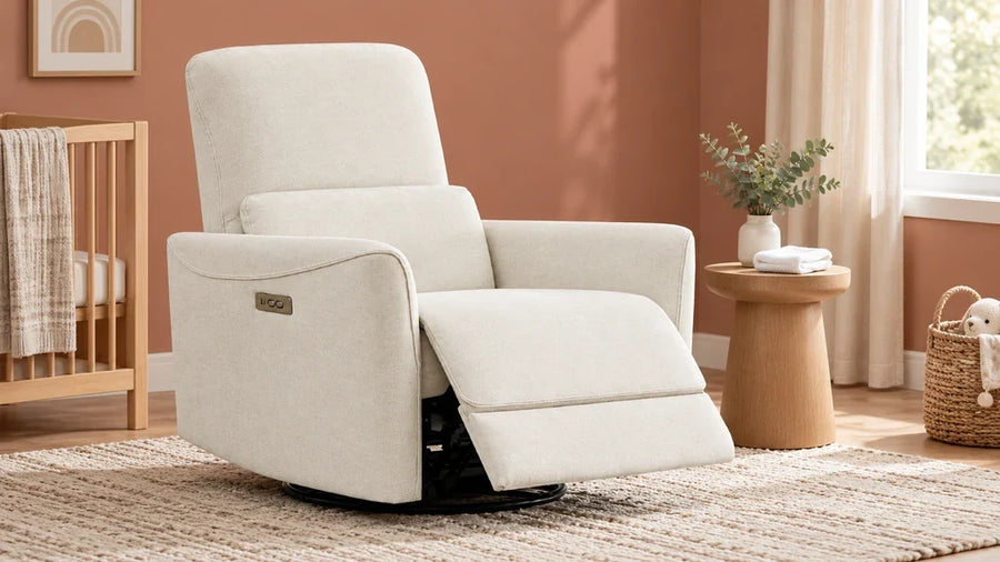 Ivory Tracee glider recliner with an extended footrest in a nursery corner.