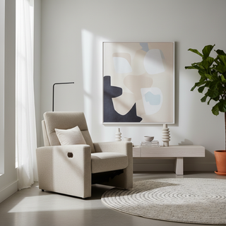 A modern minimalist living room featuring a sleek, low-profile power recliner that resembles a contemporary accent chair with no visible levers.