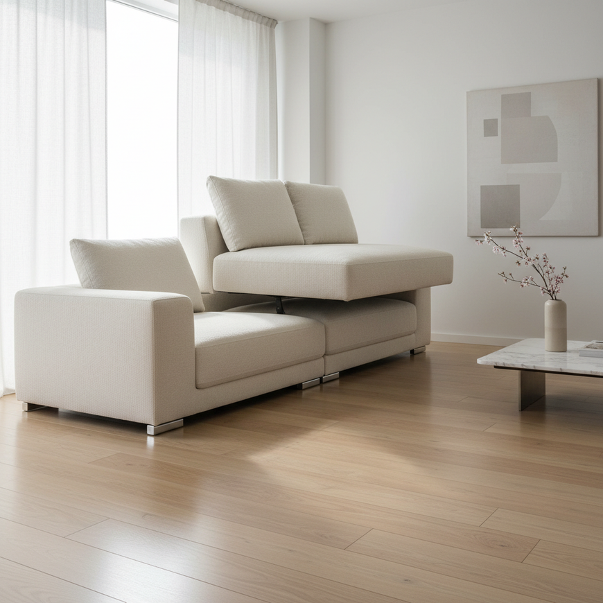 A high-end modular sofa being assembled in a bright, modern living room, showing two modules being seamlessly joined.