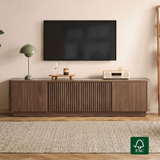 Editorial hero image showing media storage integrated into an open-concept home without blocking sightlines between connected living zones.