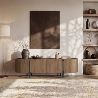 A media console in a home office demonstrates how furniture can combine equipment storage with a polished, residential workspace.