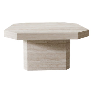 Editorial view of an open-plan living room using a geometric coffee table as the visual center of the seating zone.