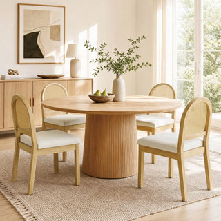 Rattan accent chair presented as a comfortable, cared-for seating piece