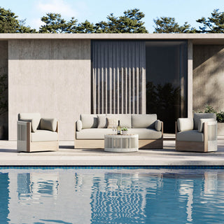 Editorial hero showing a complete outdoor furniture arrangement for poolside lounging.