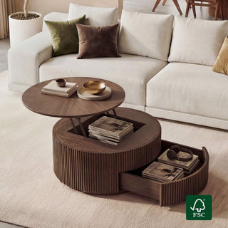 A wide editorial view of a solid wood coffee table in a living room, establishing the table as the subject of the cleaning and maintenance guide.
