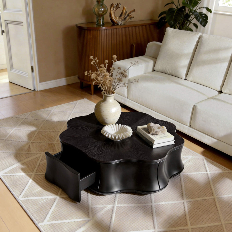 A sculptural storage coffee table anchors a movie-night seating area while keeping essentials within reach.