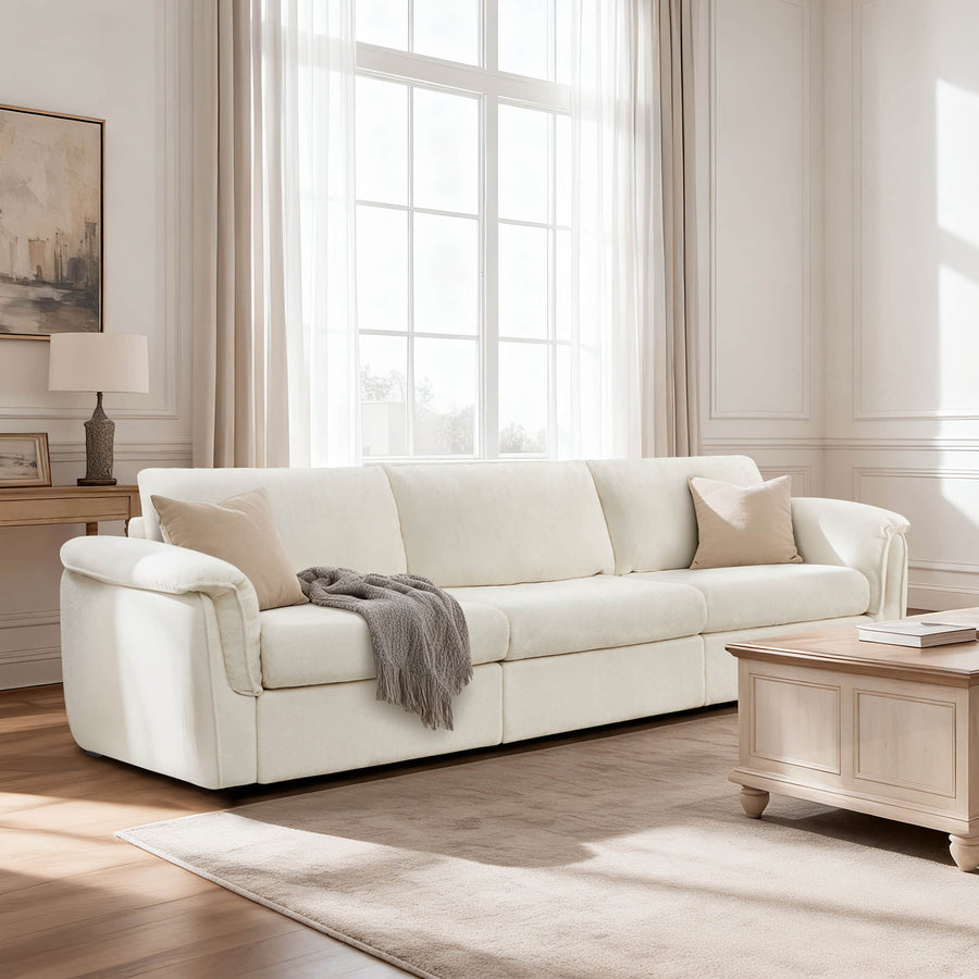 A low-profile sofa and nearby side table illustrate a practical armrest-height comparison.