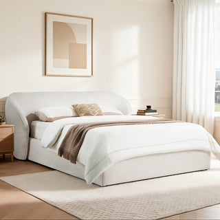 A queen platform bed shown in a furnished bedroom with surrounding floor and wall space visible.