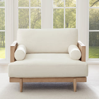 A natural cane-and-wood furniture piece shown in a bright indoor setting, illustrating the type of woven material discussed in the article.