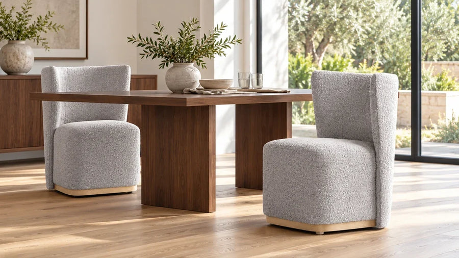 Gray Lilibet wingback dining chairs around a dark walnut table in a bright dining room.