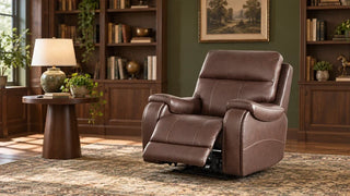 A brown Noah recliner with its footrest extended in a walnut-lined library