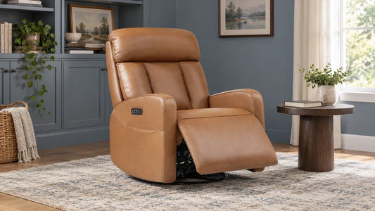Tan Maxwell recliner with a raised footrest and separate headrest in a blue-gray reading room