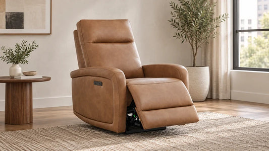 A tan Keni recliner with its footrest extended near a wall in a compact sitting area